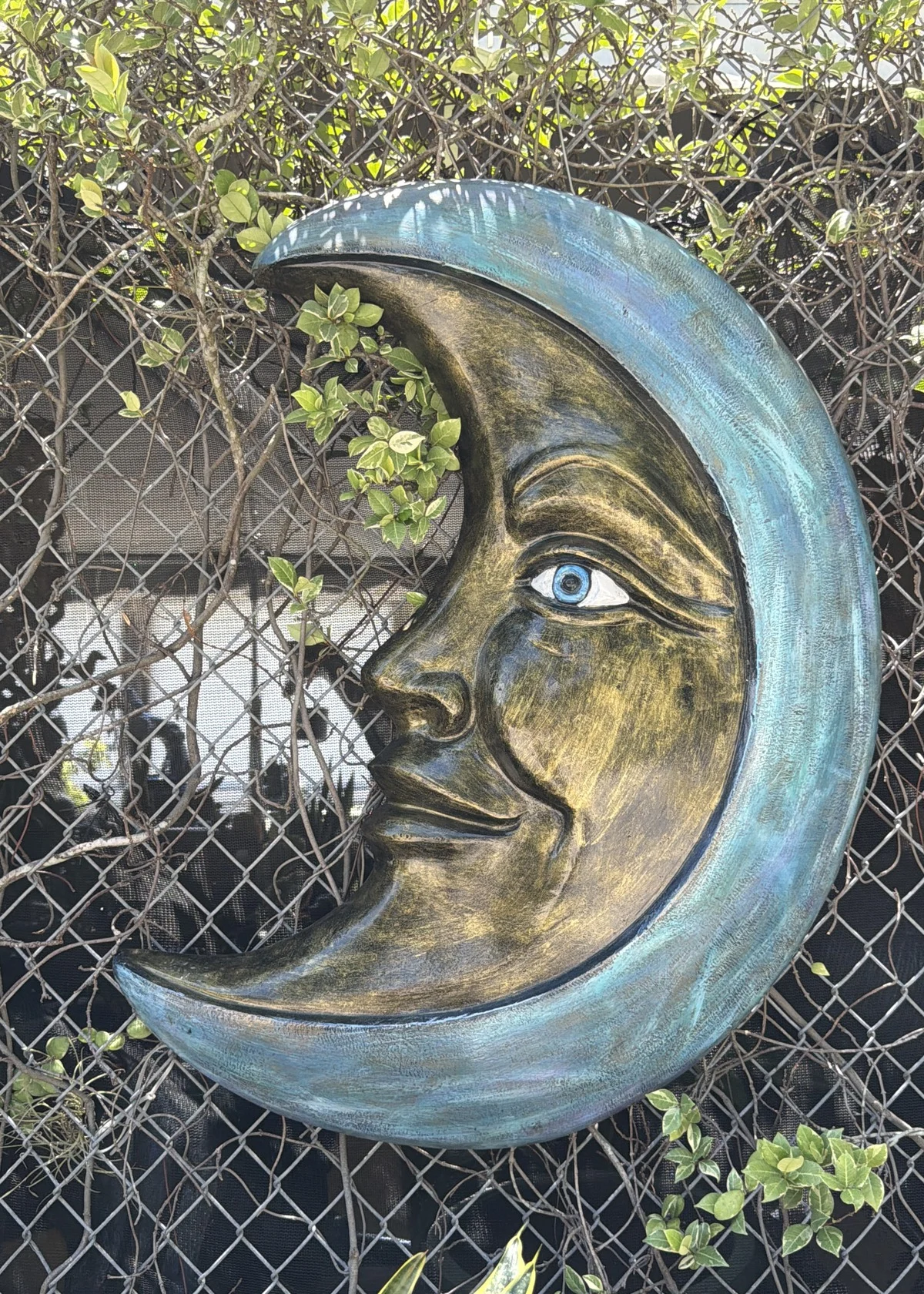 Crescent moon wall decor in bronze finish for outdoor garden display