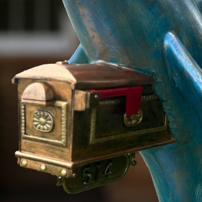 Bronze mailbox attached to a blue sculpture Statues and Sculpture Shop