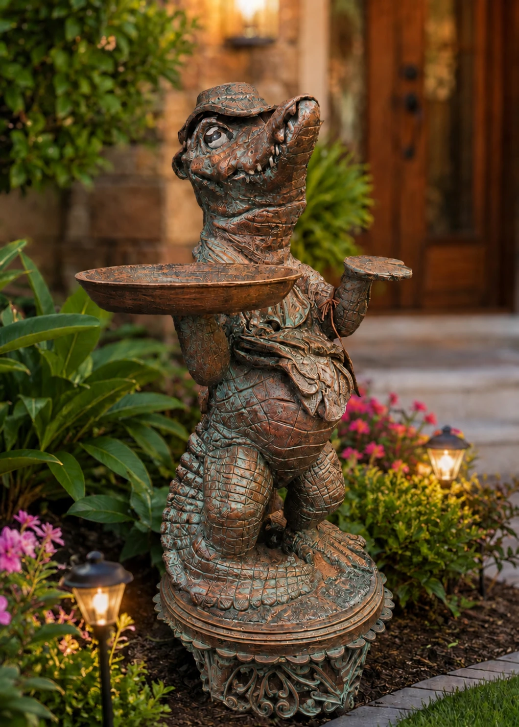 Alligator statue with tray in Aged Copper finish in a landscaped garden