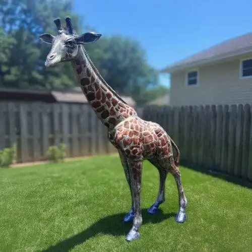 Life size giraffe statue for outdoor showing close up of hand painted details at statues and sculpture shop