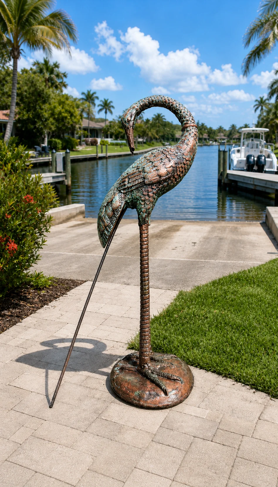 30-Inch Curved-Neck Heron Garden Statue in Aged Copper hand-painted finish displayed in a landscaped outdoor setting