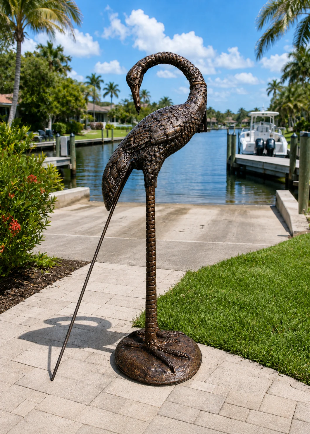 30-Inch Curved-Neck Heron Garden Statue in Antique Bronze hand-painted finish displayed in a landscaped outdoor setting