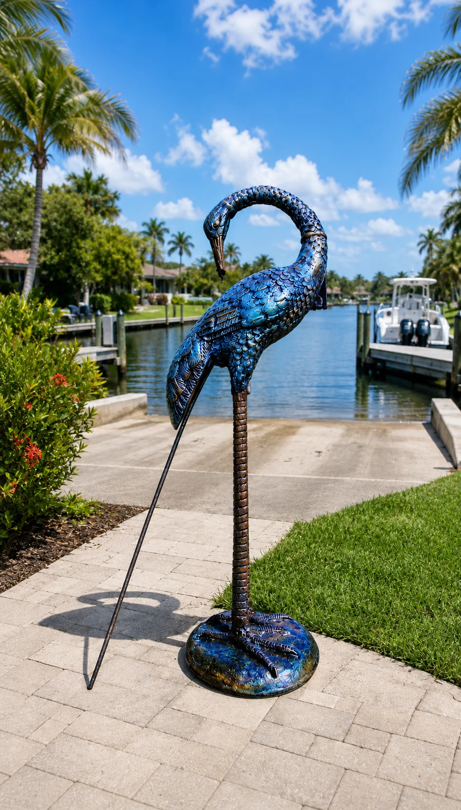 30-Inch Curved-Neck Heron Garden Statue in Coastal Blue hand-painted finish displayed in a landscaped outdoor setting