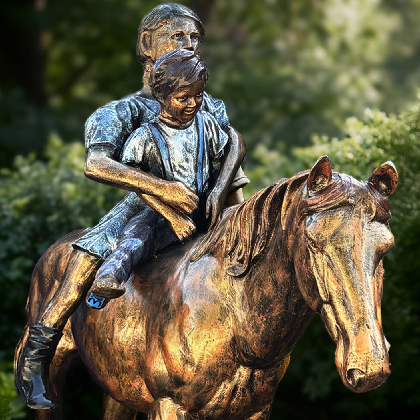 Life size horse statue with riders showing close up of hand painted details at statues and sculpture shop